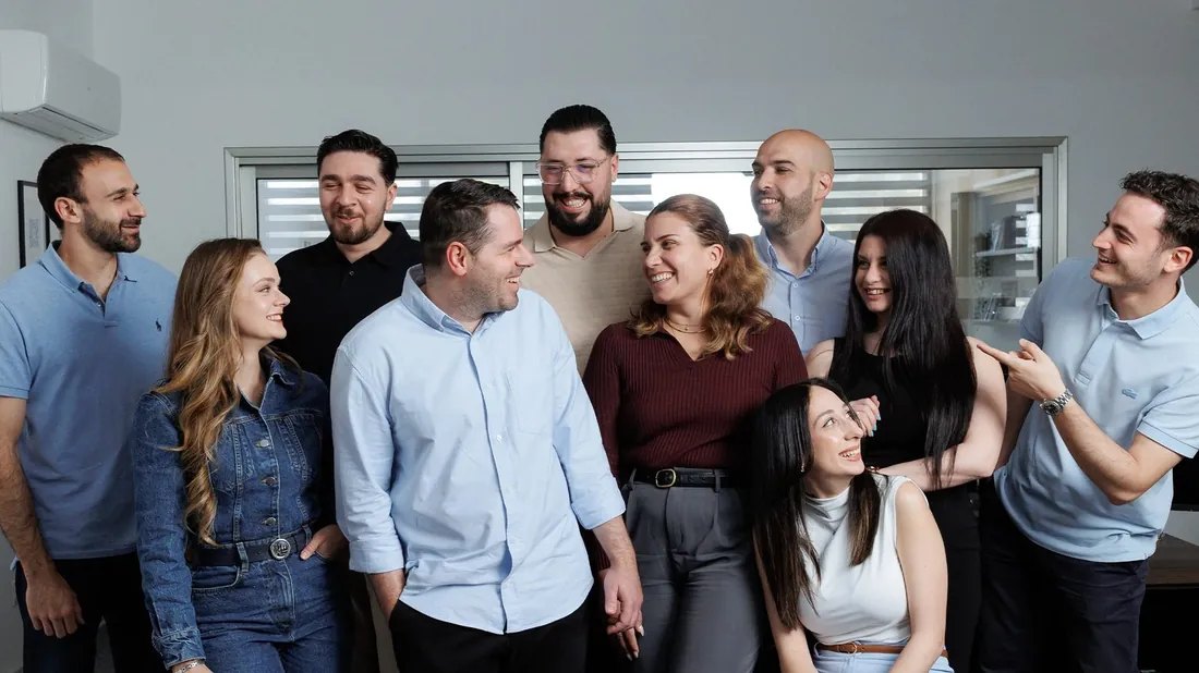 The Obsidian Co. team together at their office in Larnaca.